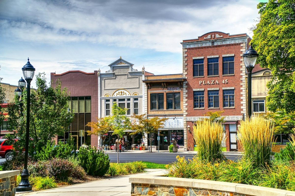 A row of buildings and shops on a street.